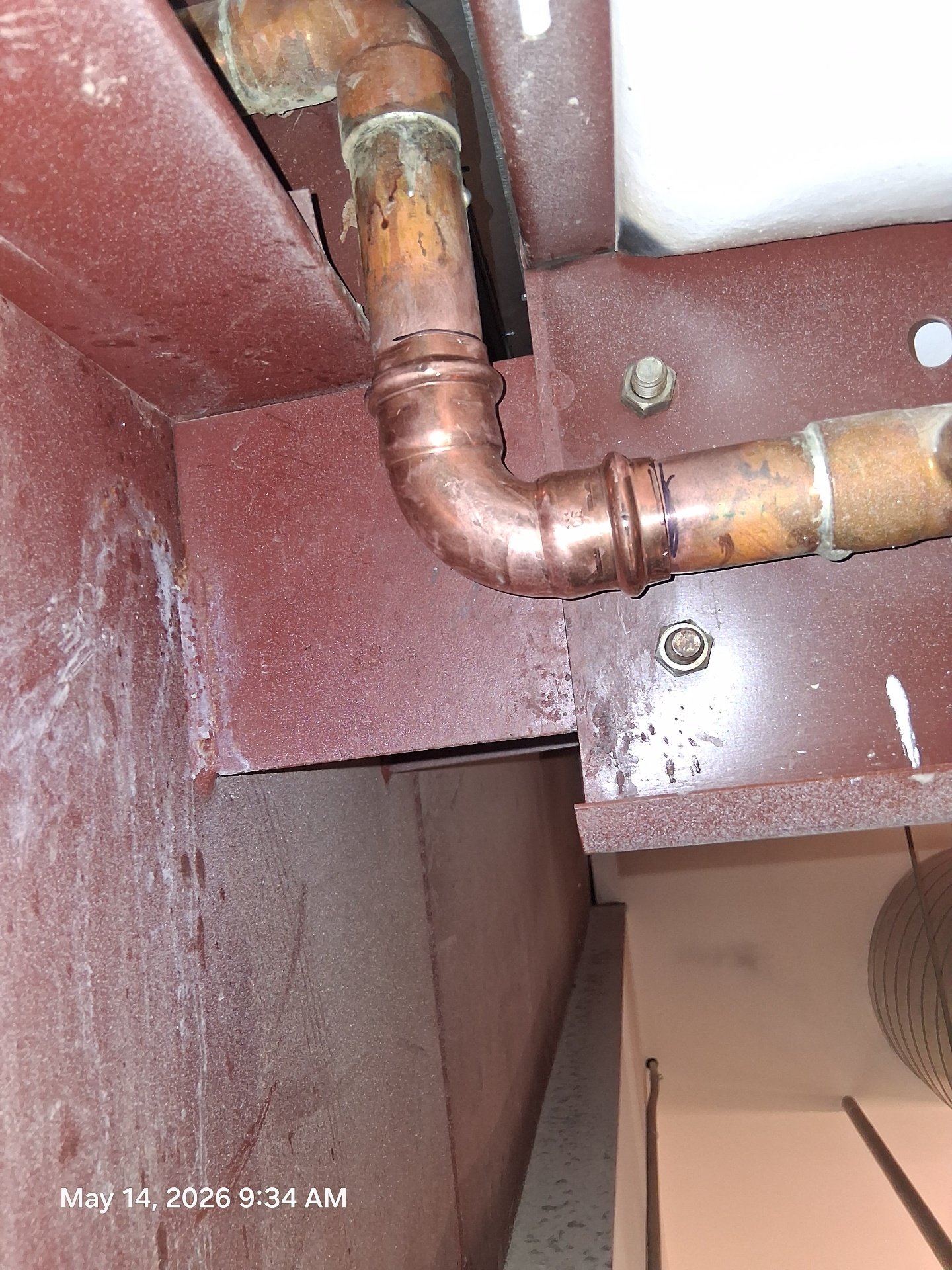 Copper pipe elbow repair and leak fix at wall connection