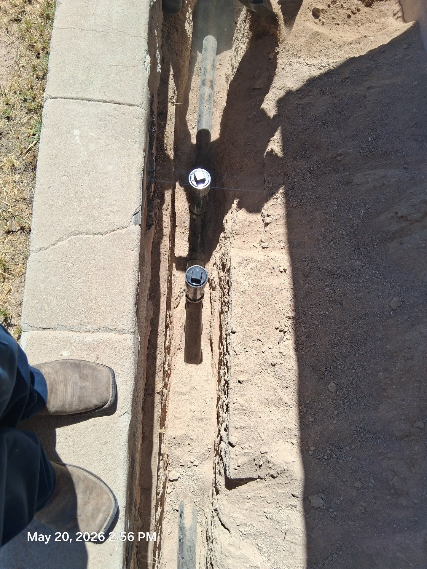 Underground clean out installation in exterior trench